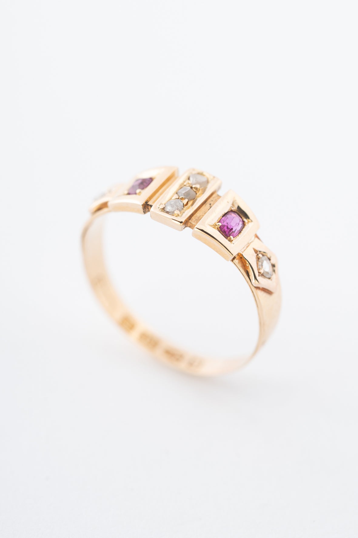 Old yellow gold English ring with rubies and diamonds