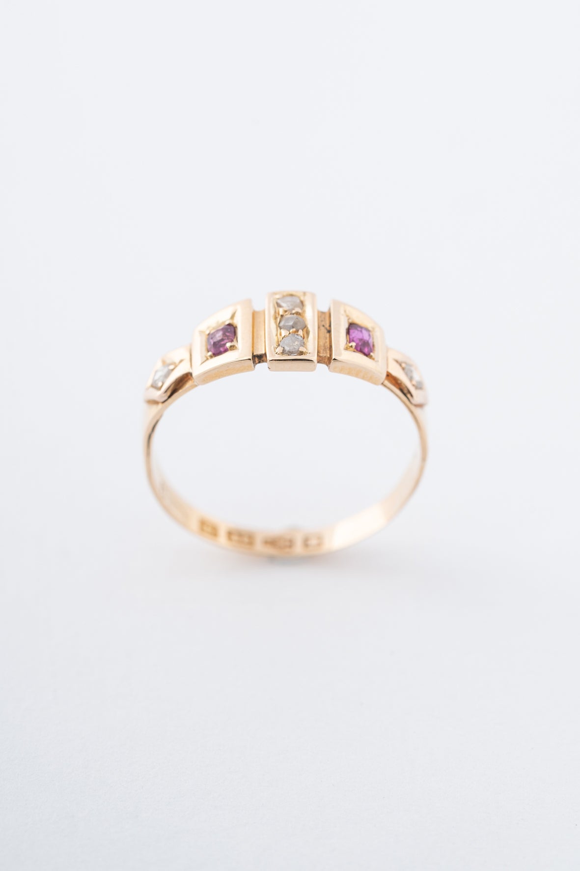 Old yellow gold English ring with rubies and diamonds