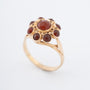 Yellow gold entourage ring with carnelian