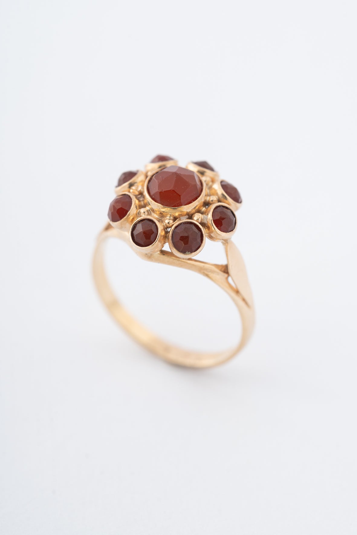 Yellow gold entourage ring with carnelian