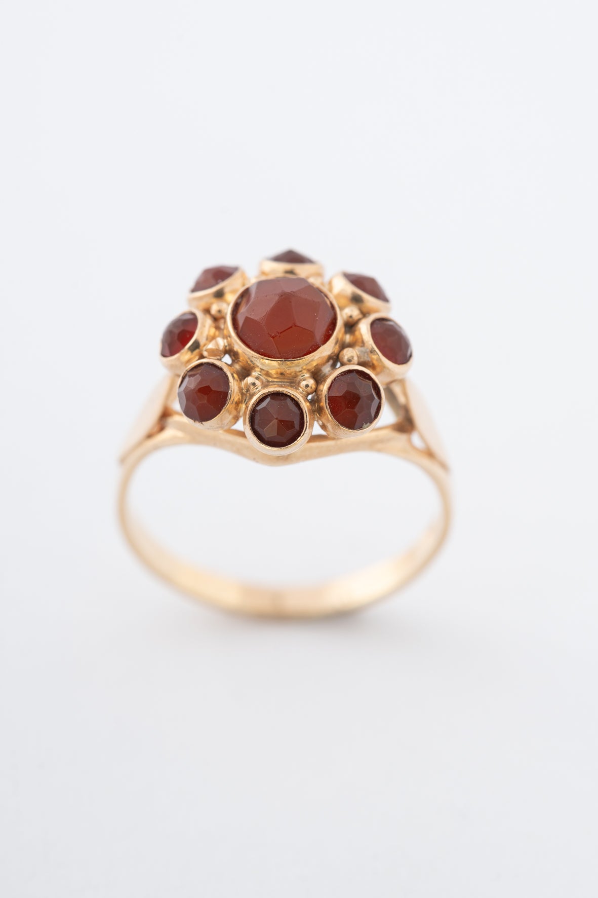 Yellow gold entourage ring with carnelian