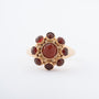 Yellow gold entourage ring with carnelian