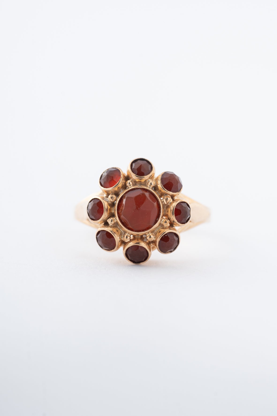 Yellow gold entourage ring with carnelian