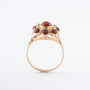 Yellow gold entourage ring with carnelian