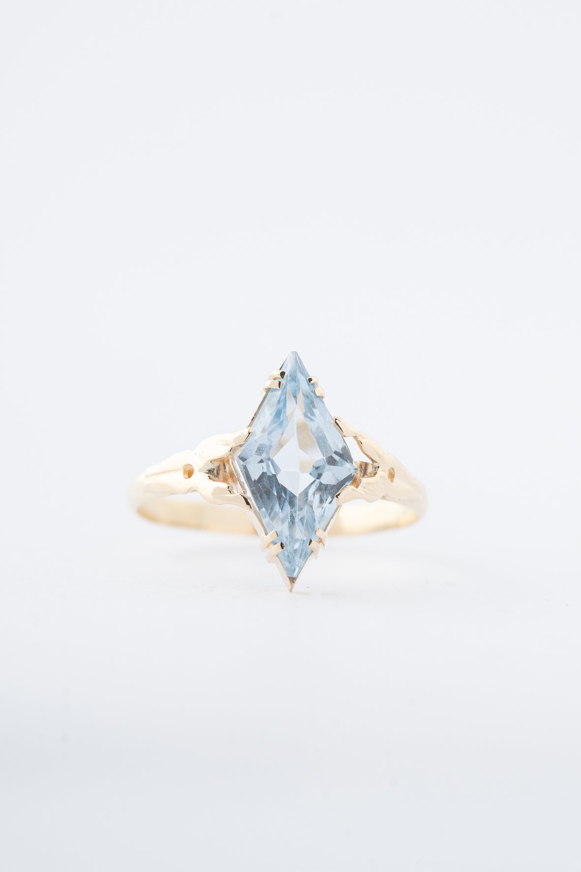 Antique yellow gold marquise ring with a blue spinel