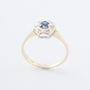 Yellow gold entourage ring with sapphire and brilliant-cut diamonds