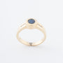 Yellow gold band ring with a sapphire and brilliant-cut diamonds