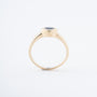 Yellow gold band ring with a sapphire and brilliant-cut diamonds