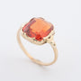 Geelgouden ring met syntretische padparaascha