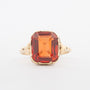 Geelgouden ring met syntretische padparaascha