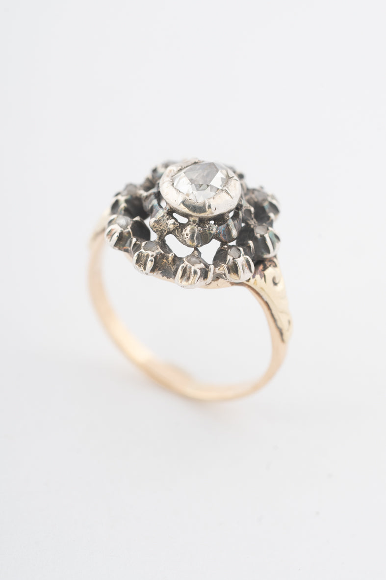 Antique yellow gold entourage ring with diamonds set in silver