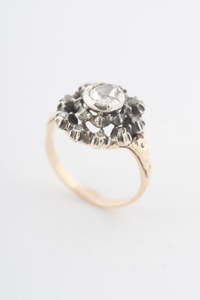 Antique yellow gold entourage ring with diamonds set in silver
