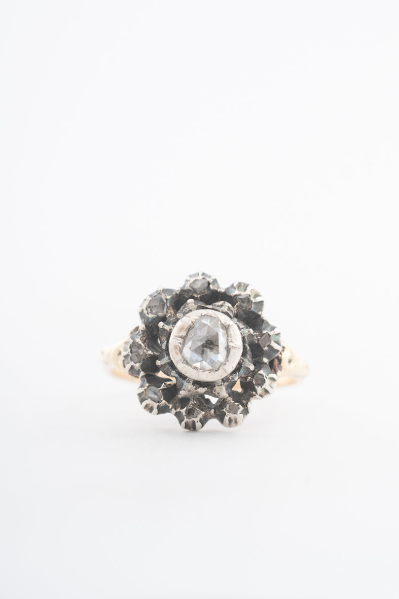 Antique yellow gold entourage ring with diamonds set in silver