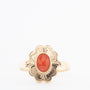 Geelgouden ring met een bloedkoraal