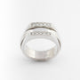 Wit gouden ring met draaibare binnen ring en briljanten van het merk Piaget