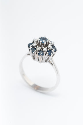 White gold double entourage ring with blue topaz and diamonds