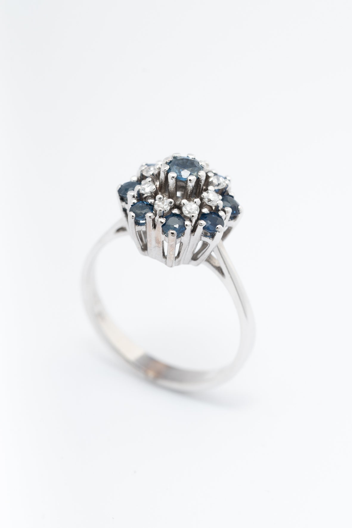 White gold double entourage ring with blue topaz and diamonds
