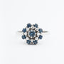 White gold double entourage ring with blue topaz and diamonds