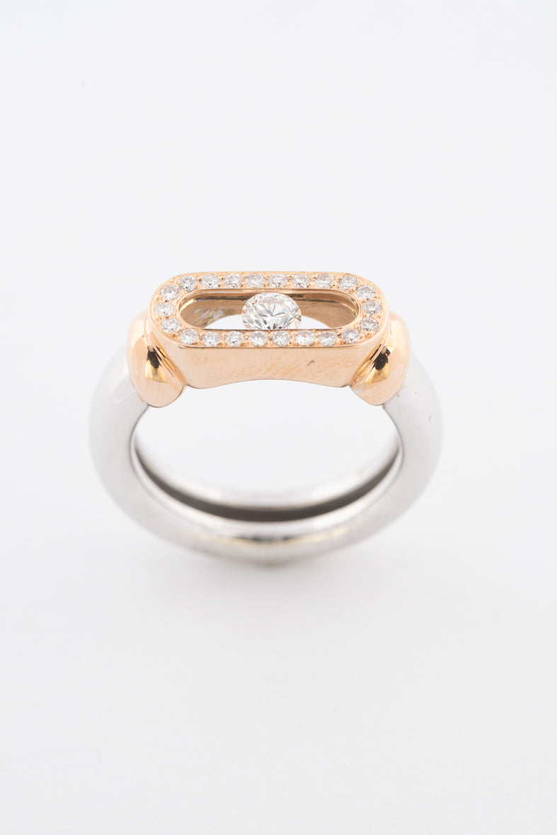 18 krt. wit/rosé gouden ring met een swinging diamond en briljanten