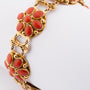 Gold bracelet with red coral