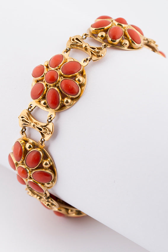 Gold bracelet with red coral