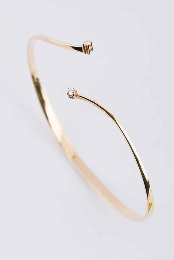 Gold clamp bracelet with brilliant