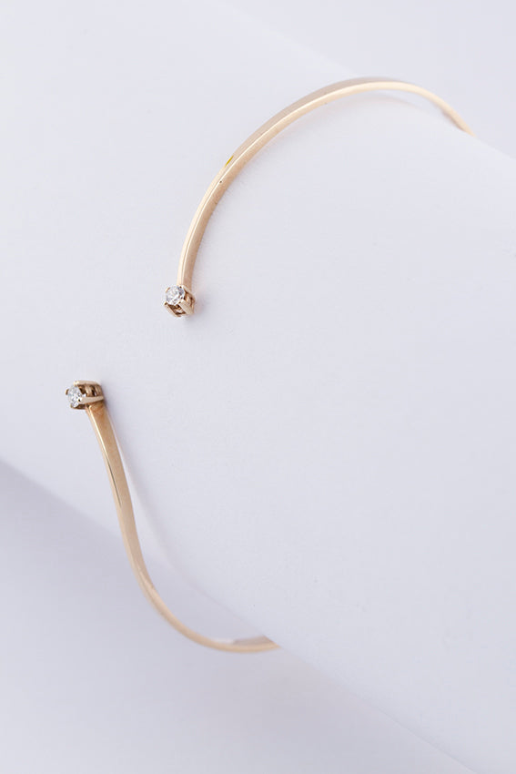 Gold clamp bracelet with brilliant