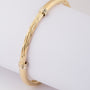 Golden twisted slave bracelet
