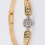 Yellow gold entourage bracelet with brilliant