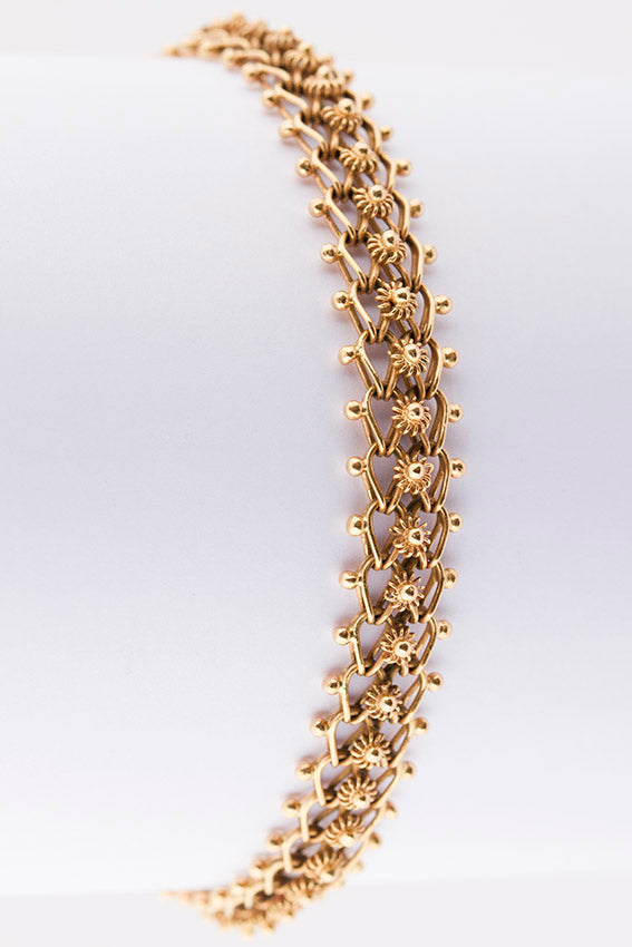 Gold link bracelet with filigree