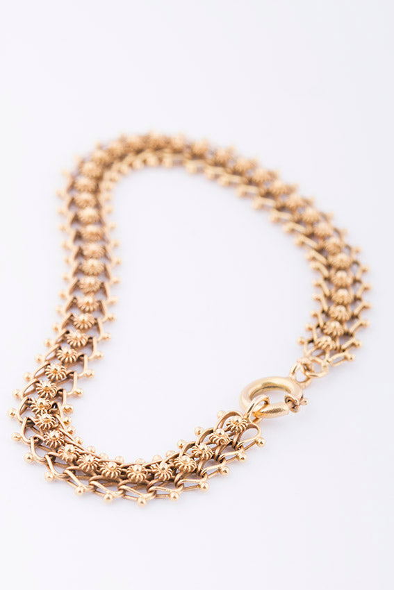 Gold link bracelet with filigree