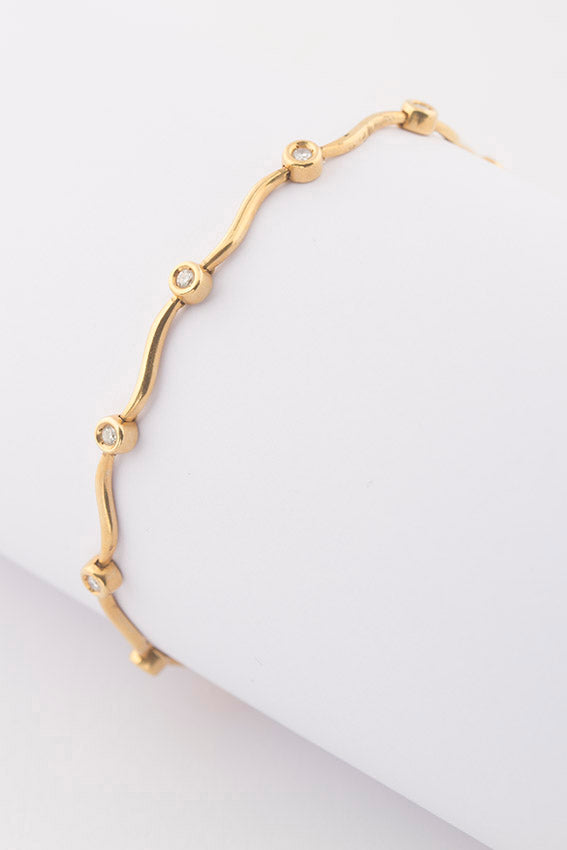 Gold tennis bracelet with diamonds