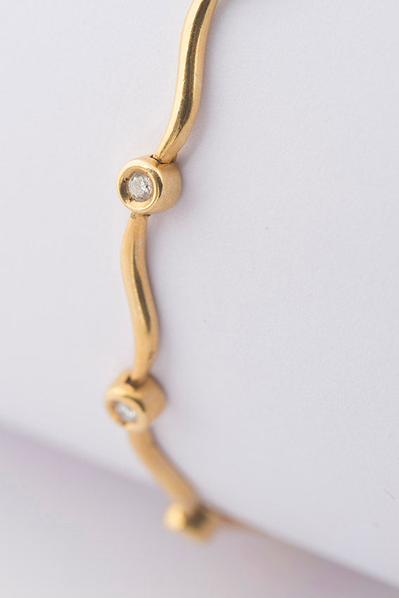 Gold tennis bracelet with diamonds