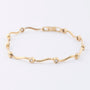 Gold tennis bracelet with diamonds
