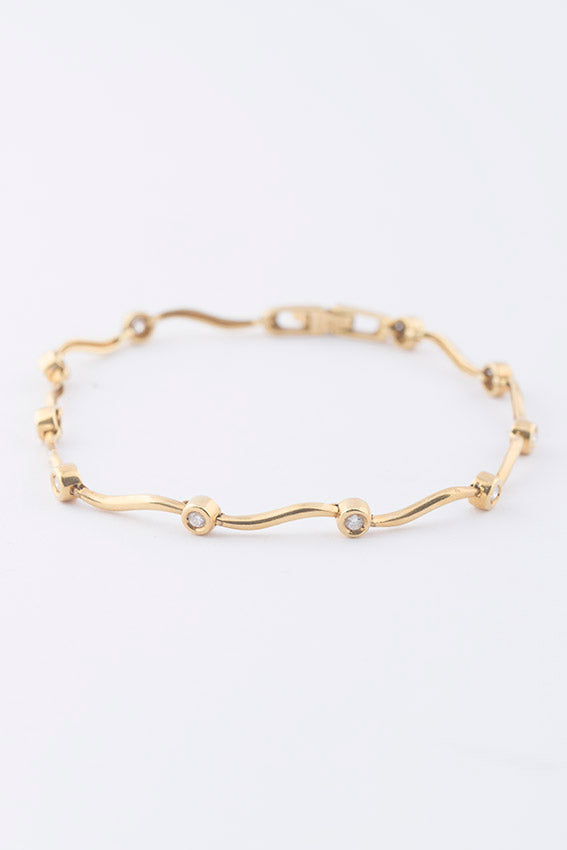 Gold tennis bracelet with diamonds
