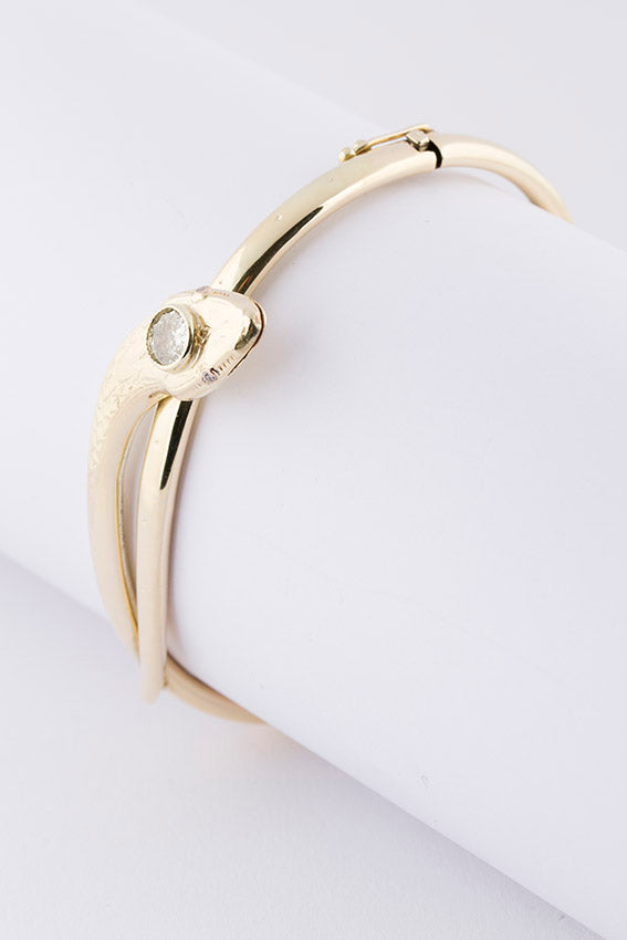 Gouden slangen armband met een briljant