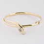 Gouden slangen armband met een briljant
