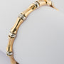 Wit/geel gouden bamboe armband met briljant