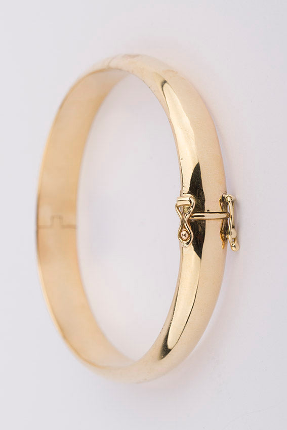 Brede gouden slaven armband