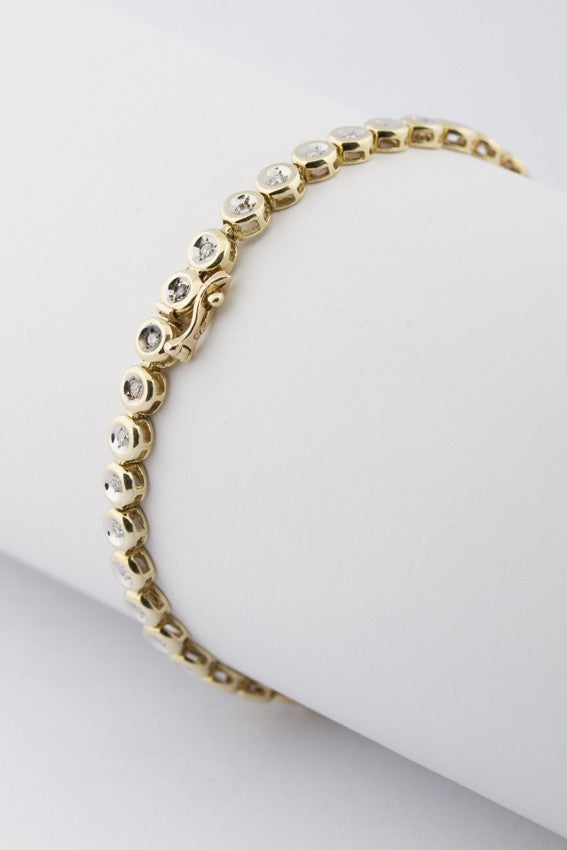 Gold tennis bracelet with diamonds