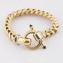Gold link bracelet with sapphire in the clasp
