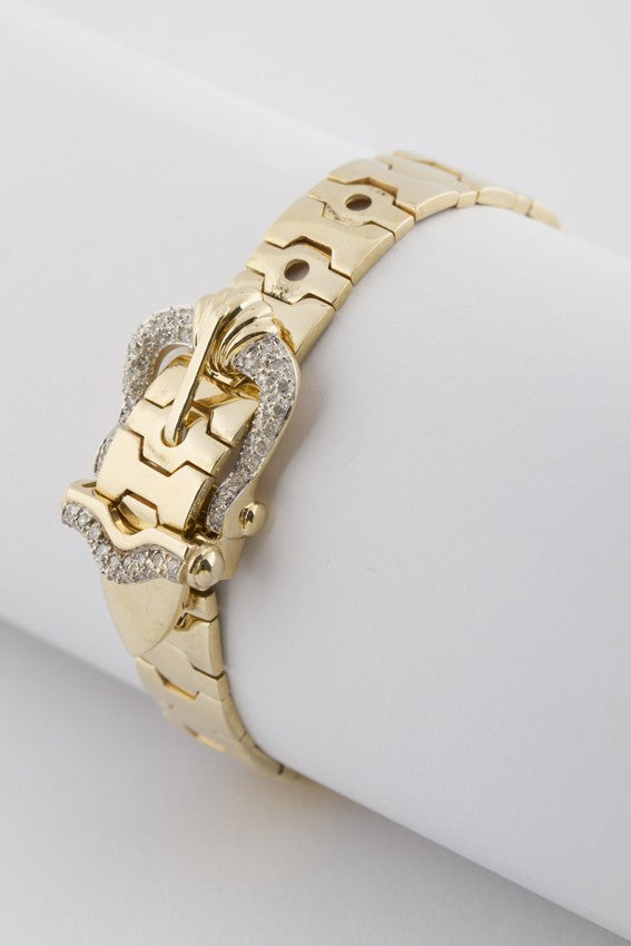 Gold buckle bracelet with diamonds