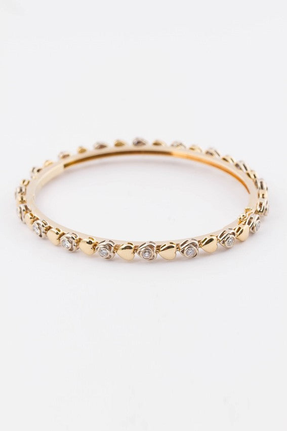 Gouden slaven armband rond bezet met briljanten