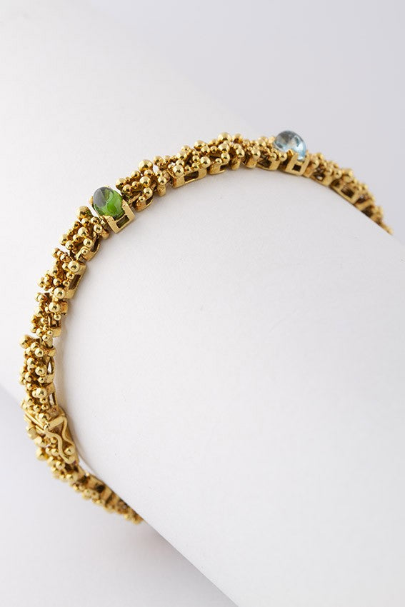 18 carat gold bracelet with various gemstones