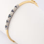 White/yellow gold slave bracelet with sapphire and brilliant