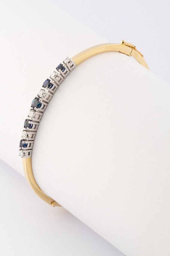 White/yellow gold slave bracelet with sapphire and brilliant