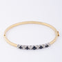 White/yellow gold slave bracelet with sapphire and brilliant