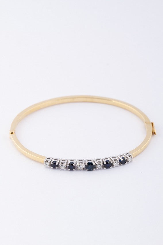 White/yellow gold slave bracelet with sapphire and brilliant