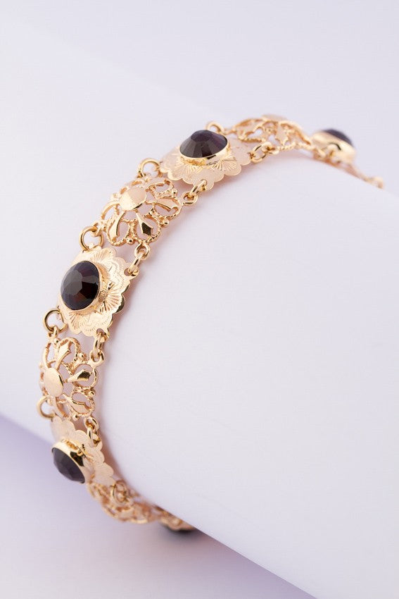 Gouden schakelarmband met granaten