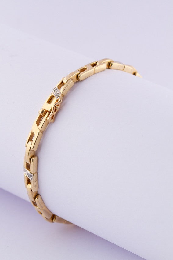 Gouden schakel armband met briljanten.